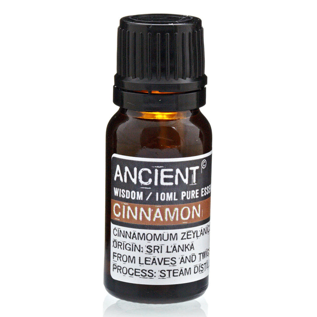 Bottle of AW Gifts Cinnamon Essential Oil for skin care, 10ml, with cinnamon sticks and natural ingredients in the background.