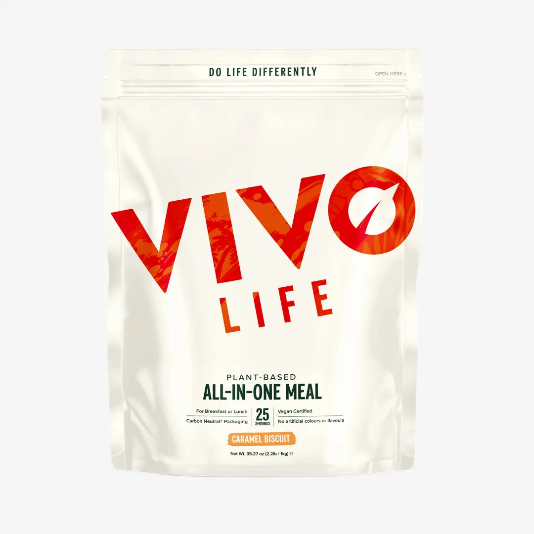 Vivo Life Whole Plant Based Nutritional Shake supplement in a glass with a spoon, showing a creamy, healthy plant-based drink.