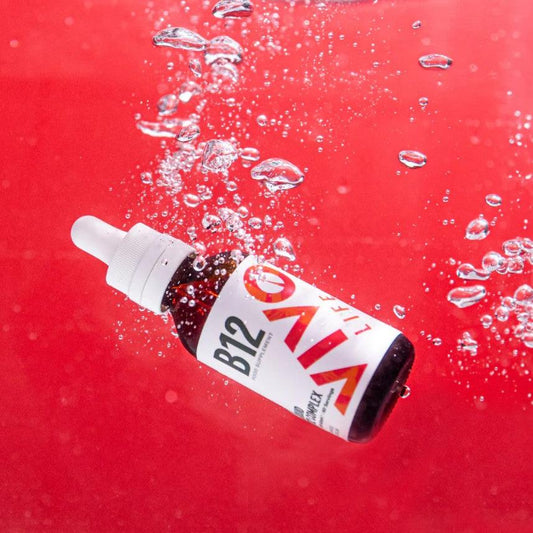High potency vegan B12 vitamin blend by Vivo Life in a clear bottle against a white background.