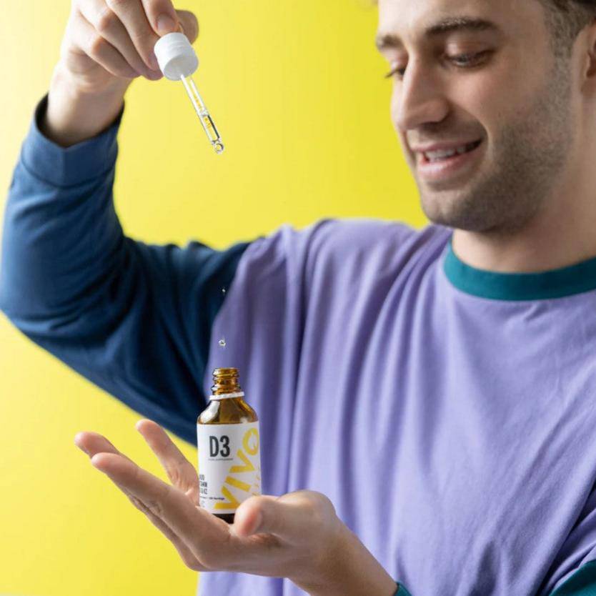 Vivo Life Vitamin D3 with K2 plant-based supplement bottle with label, showing supplement capsules and product branding.