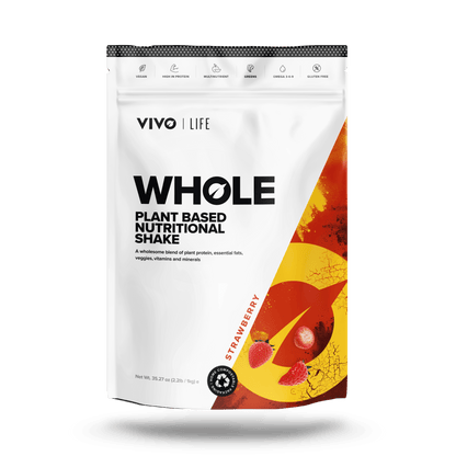 Vivo Life Whole Plant-Based Nutritional Shake in strawberry flavor, shown in a standing pouch with fresh strawberries and leafy greens.