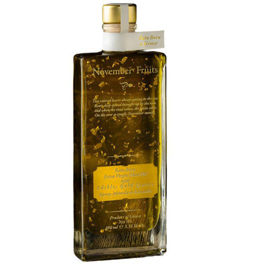 Liquid Gold olive oil with edible gold flakes from Elixir Flavours, 100ml bottle, showcasing the luxurious oil in a clear container.