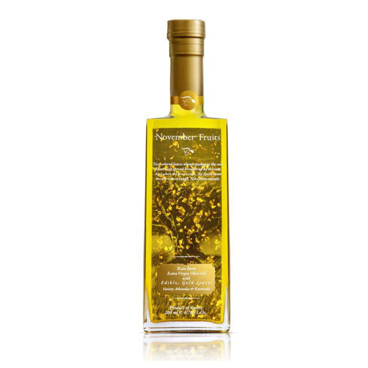 Bottle of Elixir Flavours Virgin Olive Oil PGI Laconia with a dark green label and golden cap, showcasing high-quality extra virgin olive oil.