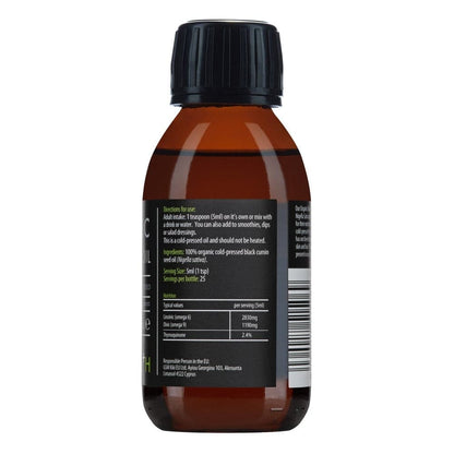 Dark glass bottle of Kiki Health Organic Black Seed Oil supplement by Herbalistas, 125ml, with a label featuring black seeds and green accents.
