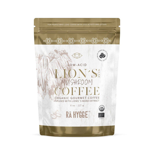 Whole beans of Rå Hygge BIO Lions Mane Coffee in a 227g package by Herbalistas, featuring earthy tones and a resealable design.