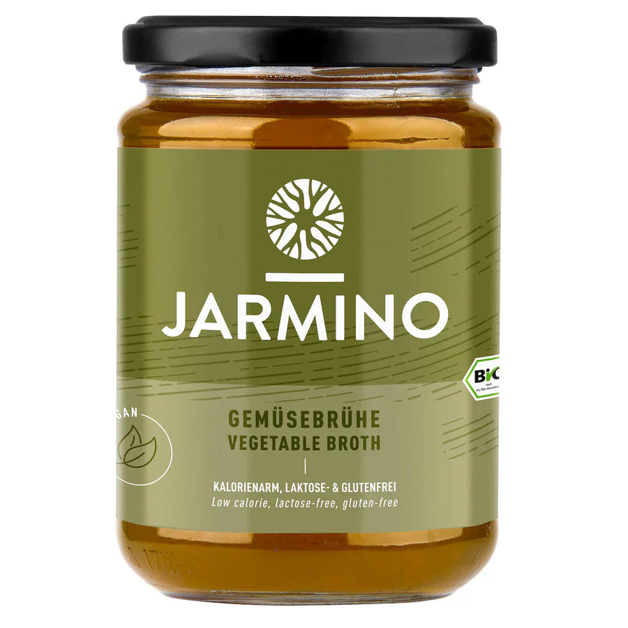 Jarmino Organic Vegetable Broth in a 350ml jar, natural vegan wellness broth with colorful vegetables visible inside